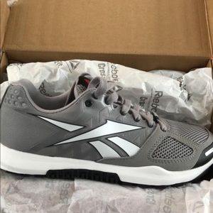 Women’s size 7 Reebok Nano. Never worn.